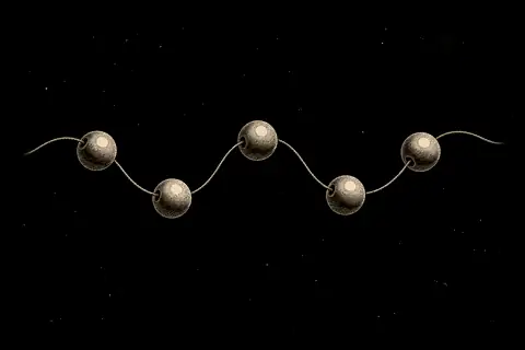 Five loose beads sit on an empty thread, with gold marking only the open space around them.